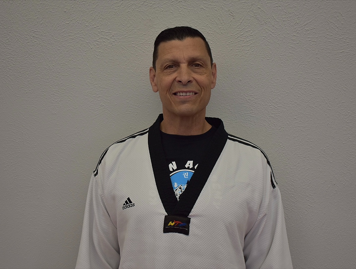 Master Christopher Ballard in a white dobok and black belt