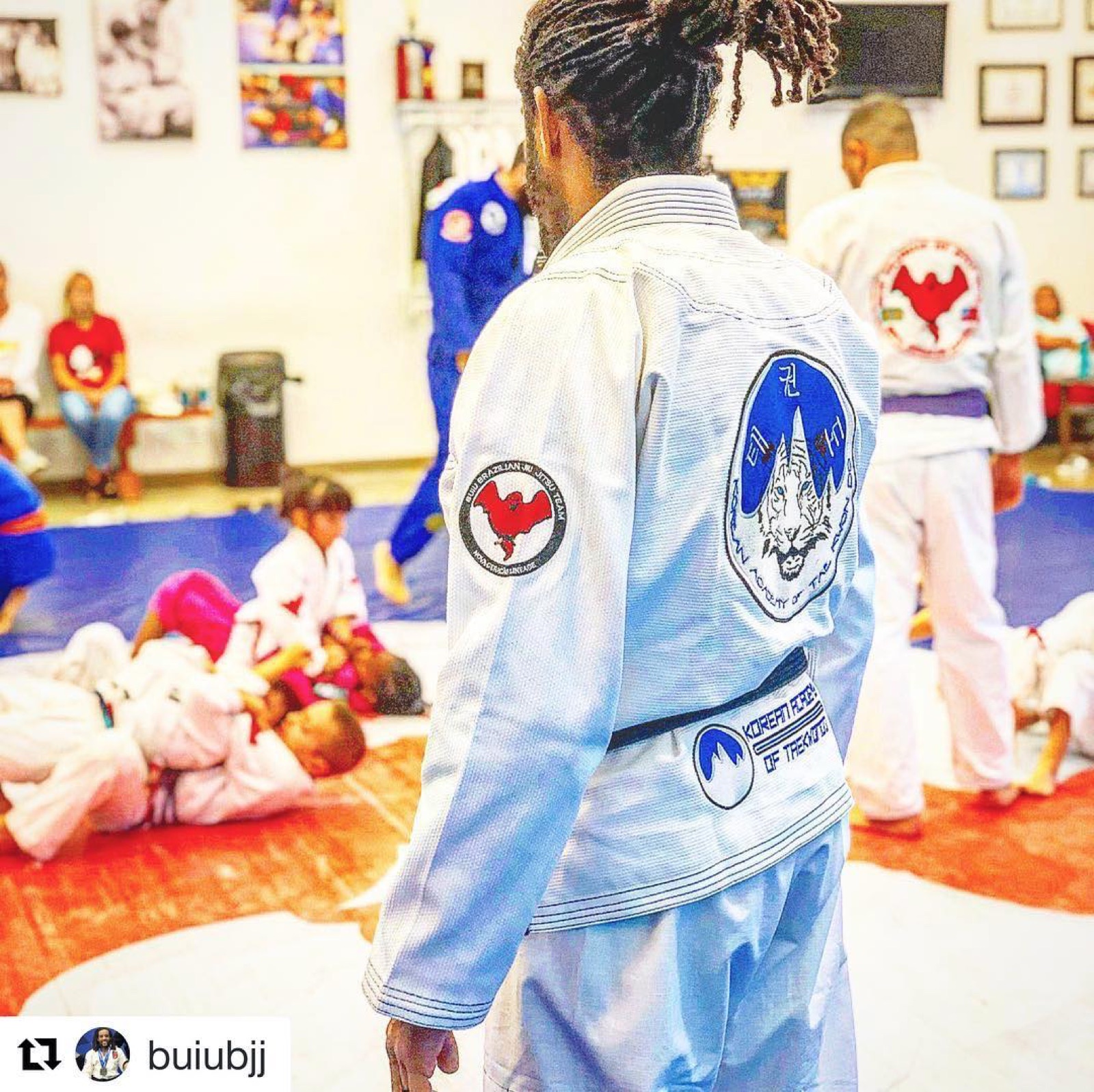 Instructors in Korean Academy gis on the mat